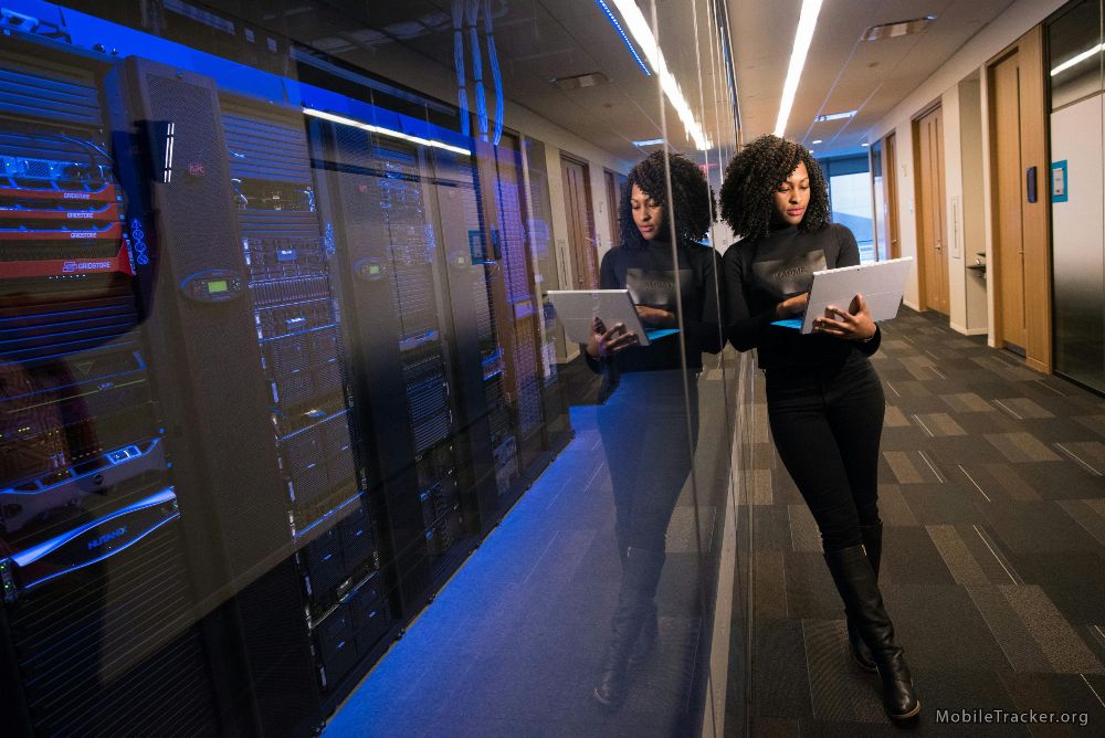 website hosting facility with woman holding laptop